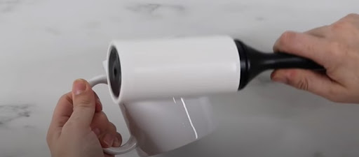 Clean the mug with the lint roller
