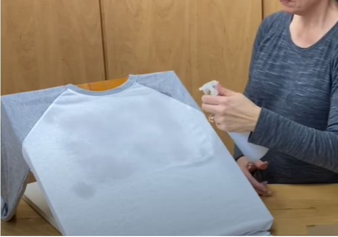 Now spray the shirt thoroughly until it gets damped.
